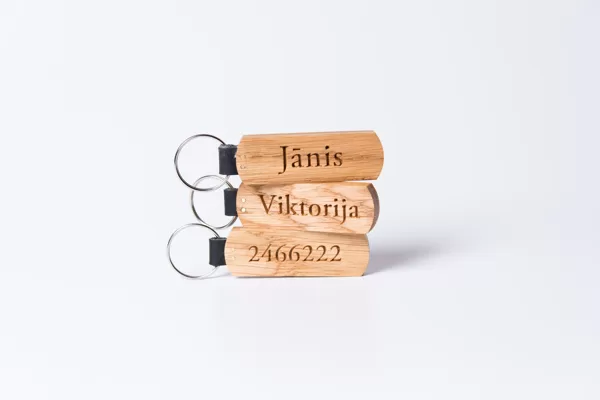 Personalised key chains, made out of oak wood and genuine leather.