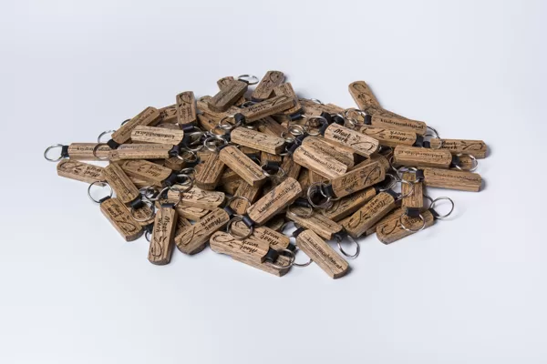 Key chains, made out of oak wood and genuine leather. Corporate client order.