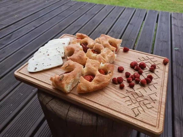 Food serving board, made out of oak wood. Processed with food safe wax.